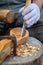 Craftsman demonstrates the process of making wooden spoons handmade using tools.