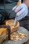 Craftsman demonstrates the process of making wooden spoons handmade using tools. National crafts concept.