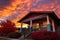 craftsman house featuring overhanging eaves against a colorful sunset