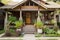 craftsman house with porch swing and potted plants