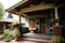 craftsman house with porch swing and potted plants