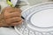 Craftsman painting and decorating ceramic products in pottery factory in Fez, Morocco