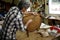 Craftsman repairing wooden armchair