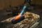Craftsman is smelting metal with soldering torch