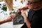 Craftsman staring at a jewelry item on the woman hand