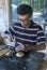 A craftsman starts the process of making a brass container at Sigiriya in Sri Lanka.