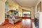 Craftsman-style family room with brown sofa and fireplace.