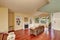 Craftsman-style family room with brown sofa and fireplace.