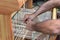 Craftsman weaver working on wooden hand-loom