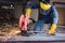 Craftsman Welding is Cutting Steel Work, Welder Man in Safety Protective Equipment Doing Metalwork in Construction Site.