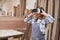 Craftsman woman looks through VR glasses