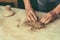 Craftsman working the clay with his hands to make figures for spectacular ornaments with clay, water, plants and mix everything