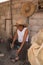 Craftsman working in his workshop, carving the stone to make molcajetes