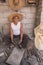 Craftsman working in his workshop, carving the stone to make molcajetes