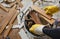 Craftsman in workwear removes the parquet flooring and fills the buckets with the wooden slats during the house renovation process