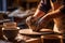 Craftsmanship Unveiled: A Potters Hands Shaping a Clay Vase in a Well-Lit Studio