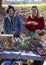 A craftswoman promotes her line of hand-crocheted succulents and animals at an outdoor market