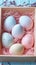 Crafty Easter gift idea Pastel colored eggs arranged in box