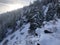 Craggy rocks covered with snow, mountainside