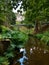 Cragside gardens in Northumberland with reflections in stream