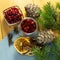 Cranberries in a glass plate. Frozen lingonberries in a glass plate on a wooden table.