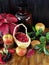 Cranberries in a wicker basket surrounded by apples, black rowan and red autumn leaves