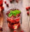 Cranberry cocktail with mint garnish.