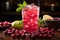 Cranberry drink cocktail with ice and lime on dark background