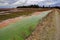 Cranberry fields by a farm road