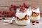 Cranberry granola parfaits in mason jars over wood