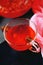 Cranberry herbal hot tea drink in glass teapot with cinnamon and