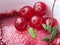 Cranberry jam with sugar in a white bowl