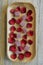Cranberry marmalade and rose petals on wooden tray