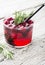 Cranberry Mojito portioned in glasses decorated with coconut. selective Focus