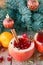 Cranberry mulled wine, apples, tangerines and spices on the table.