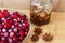 Cranberry on plate with anis, honey on table