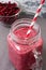 Cranberry smoothie in Mason jar