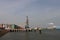 Crane along quay at the Oude Maas river in the botlek harbor