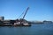 Crane on barge does Pier repair work with Coit Tower