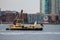 A Crane barge on the Hudson River, Manhattan, NYC.