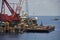 Crane barge lifting heavy cargo or heavy lift in offshore oil and gas industry. Large boat working for lift piping