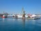 Crane and big ships in a sea port blue sea