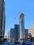 Crane at building under construction lifting window material in Chicago Loop