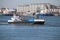 Crane and cargo ship Barge 2 in the botlek port at chemical industries in the Botlek Harbor in Rotterdam