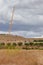 Crane for the construction of a wind turbine in the middle of the field