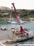 Crane at the harbour in Gozo, Malta