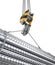 Crane hook hanging on a steel ropes with big steel reinforcement pack