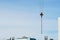 Crane hook with slings for the construction of a residential building. Close-up, blue sky, construction fittings sticking