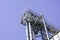 Crane for industrial handling of goods in the port with blue sky in the back