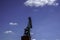 Crane for industrial handling of goods in the port with blue sky in the back